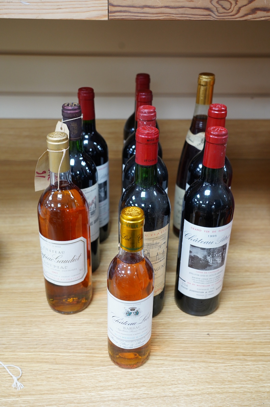 Eleven bottles of wine to include six bottles of Chateau Pitray 1995, a bottle of Chateau La Lagune Haut Medoc 1973, a bottle of Chateau La Tour De Mons Grand Vin Margaux 1982, a bottle of Chateau Loupiac Gaudiet Loupiac